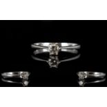 Platinum And Diamond Single Stone Ring Set with a round modern brilliant cut diamond, fully