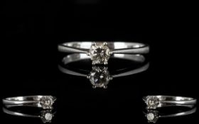 Platinum And Diamond Single Stone Ring Set with a round modern brilliant cut diamond, fully