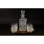 A Whiskey Decanter With Tray Square form cut glass decanter with four cut crystal tumblers,