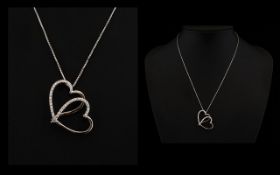 18ct Gold Interlocking Hearts Pendant Two tone gold, set with round modern brilliant cut diamonds,