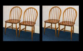 Ercol Four Mid Century Windsor Dining Chairs Of typical form, each with impressed mark to underside,