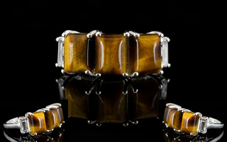 Tiger's Eye Three Stone Band Ring, accented with white topaz; the three rectangular cabochon cut