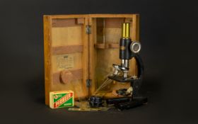 A Student's Microscope By Milbro Housed in original fitted box, as found condition.