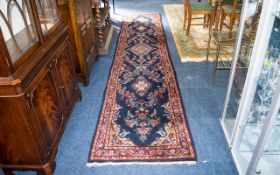 A Traditional Afghan Wool Runner In traditional Persian design with triple border and central