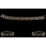 A White Metal Diamond Set Bracelet Fancy link bracelet set with eight round cut diamonds, unmarked,