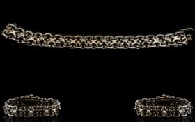 A White Metal Diamond Set Bracelet Fancy link bracelet set with eight round cut diamonds, unmarked,