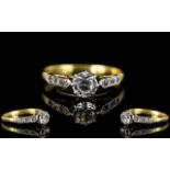 18ct Gold and Platinum CZ Set Ring, The Central Faceted Brilliant Cut CZ with Six Small Stones Set