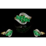 Colombian Emerald Cluster Ring, six oval cut Colombian emeralds set in a sweep across the front of