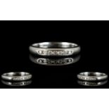 Platinum And Diamond Eternity Ring Channel set with seven round modern brilliant cut diamonds, fully