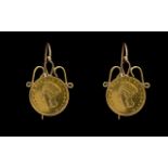A Pair Of 1862 USA $1 Coin Earrings Wired earrings set with Indian head coins.
