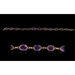 A 14ct Gold And Amethyst Set Bracelet Elegant yellow gold bracelet set with twelve faceted