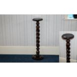 A Mahogany Barley Twist Plant Stand. Turned base with barley twist standard and circular top.