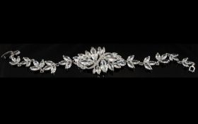White Austrian Crystal Leaf Bracelet, with a solid, curved centrepiece with sprays of stylised
