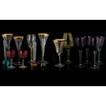 A Collection Of Glass Vessels Thirteen pieces in total to include four amethyst bowl wine glasses,