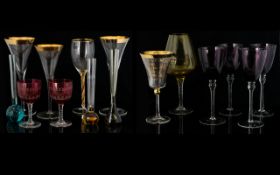 A Collection Of Glass Vessels Thirteen pieces in total to include four amethyst bowl wine glasses,