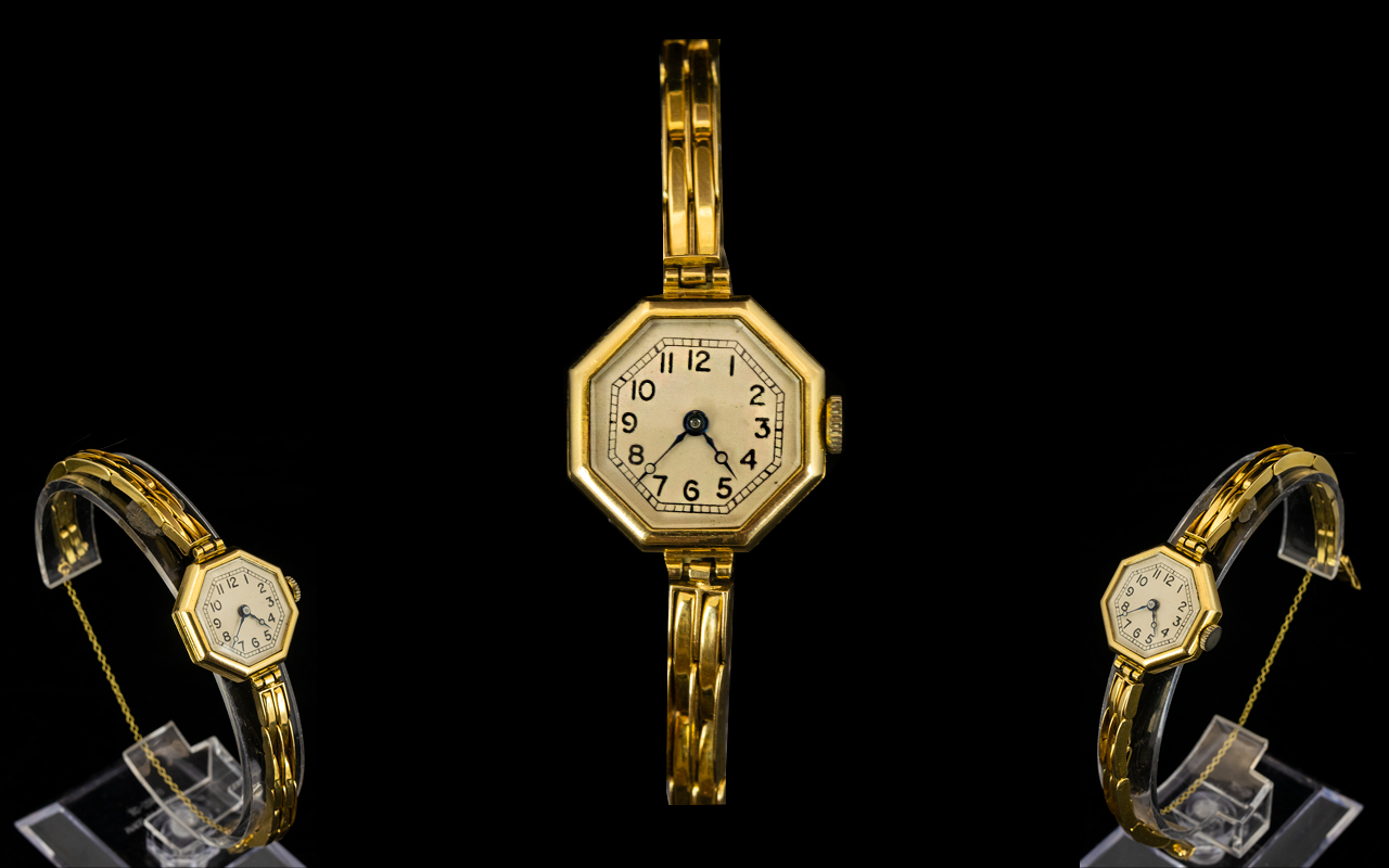 1920's Ladies 18ct Gold Octagonal Shaped Mechanical Wrist Watch with 18ct Gold Integral Bracelet.