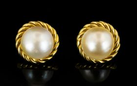 18ct Gold Pearl Set Earrings Circular form with French clip fastening,