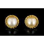 18ct Gold Pearl Set Earrings Circular form with French clip fastening,