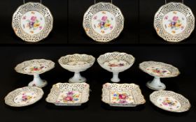 Early 20th Century Dresden Tazza And Plates All of reticulated form with Deutsche blume decoration.