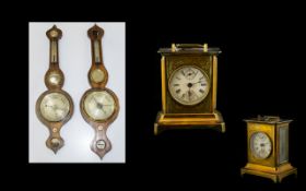 A Pair Of Late 19th And Early 20th Century Barometers Oak cased barometers Each of traditional form