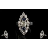 18ct White Gold Marquis Shaped Diamond Cluster Ring The central cushion curt diamond between two