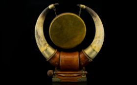 A Golden Oak Table Gong Comprising nickel mounted polished buffalo horns with central gong on