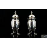 Late Victorian Period SIlver Pair of Pepperettes with Domed Tops and Splayed Feet.