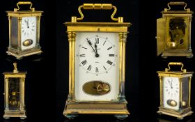 A Brass Cased Carriage Clock Comprising white enamel dial, Roman numerals with outer minutes track,