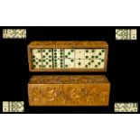 Antique Bone Dominoes In Carved Olive Wood Box Monochrome bone dominoes housed in intricately