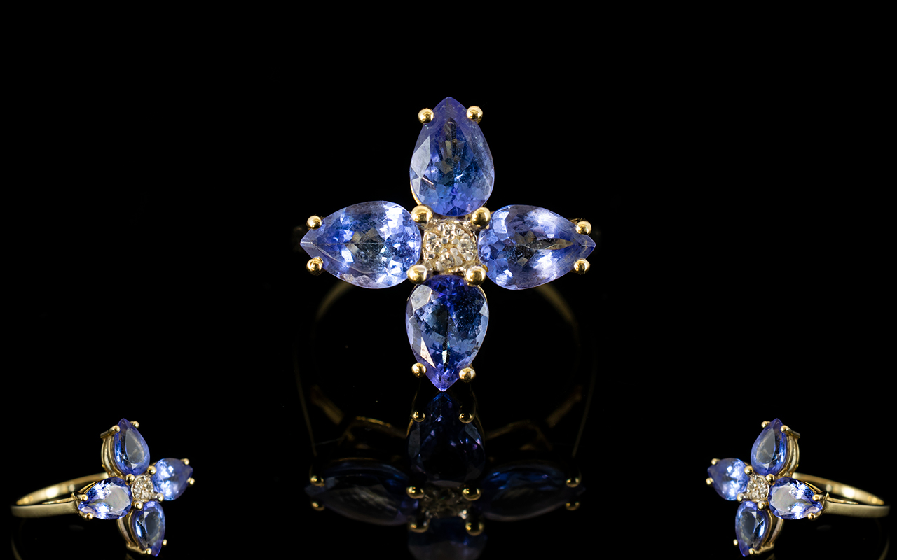 9ct Gold Tanzanite And Diamond Ring Central diamonds surrounded by four pear cut tanzanites.