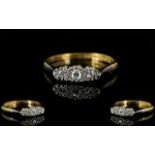 18ct Gold and Platinum Attractive and Petite 3 Stone Diamond Set Dress Ring of Pleasing Form.