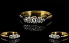 18ct Gold and Platinum Attractive and Petite 3 Stone Diamond Set Dress Ring of Pleasing Form.