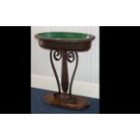 A Mahogany Plant Trough - raised on oval base with reeded,