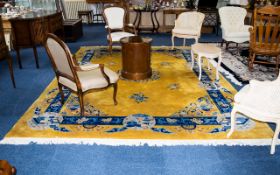 A Very Large Oriental Wool Rug Ochre ground with cobalt and sky blue borders and taupe/cream