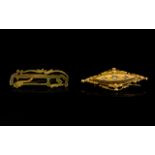 A 15ct Gold Late Victorian Bar Brooch Of lozenge form set with three central diamonds,