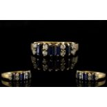 9ct Gold Chanel Set Sapphire and Diamond Ring - of pleasing design/form.