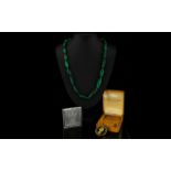 Early 20th Century Malachite Bead Necklace Comprising graduating capsule form malachite beads of