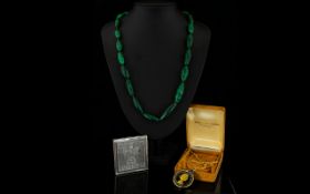 Early 20th Century Malachite Bead Necklace Comprising graduating capsule form malachite beads of