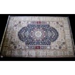 A Very Large Woven Silk Carpet Keshan rug with blue ground and traditional Middle Eastern floral