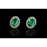 A Pair Of 14ct White Gold Emerald And Di