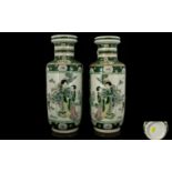 A Pair Of Famille Vert Vases Each with v