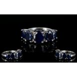 Sapphire Five Stone Band Ring, five oval cut sapphires, graduating down, either side of the centre