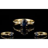 18 Carat Gold Sapphire and Diamond Set Dress Ring of contemporary design.