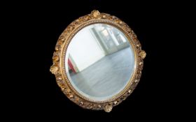 A Late 19th/Early 20th Century Circular Mirror Bevelled Glass Mirror Housed In Ornate Gilt Geso