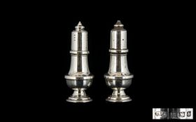 A Silver Salt And Pepperette Each of plain form fully hallmarked - Birmingham E - 1979.