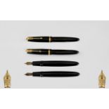 Parker Duofold Black Rubber Cased Fountain Pens - Two in Total. Both with 14ct gold Duofold nibs.
