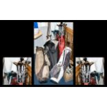 A Quantity Of Golf Clubs Comprising five canvas and leatherette bags containg approx 40 clubs and