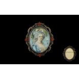 Antique Portrait Miniature Mounted in white metal frame with coral cabochon and marcasite ribbon