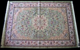 A Large Woven Silk Carpet Keshan rug with eau de nil ground and traditional Middle Eastern floral