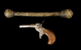 19th Century Single Fire Dog Gun Comprising steel barrel and wooden grip, unmarked.